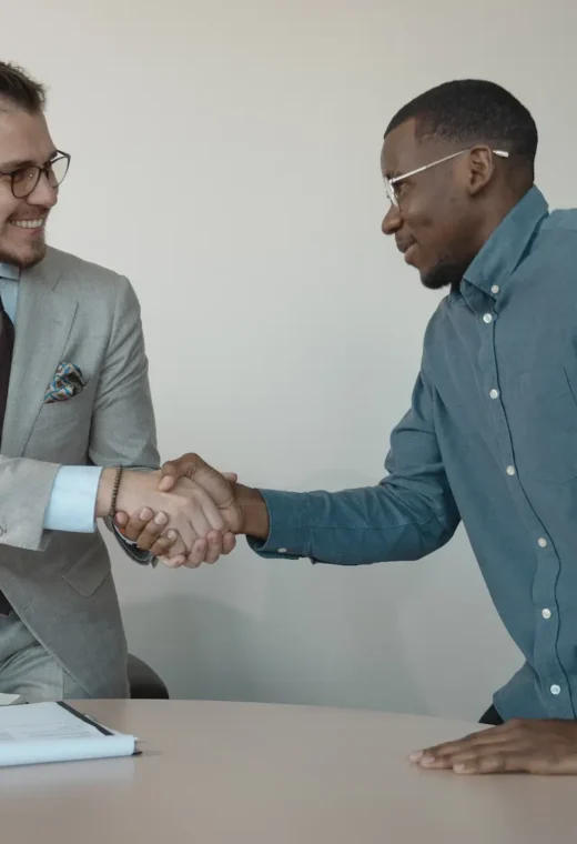 two people shaking hands during healthcare assistant interview questions