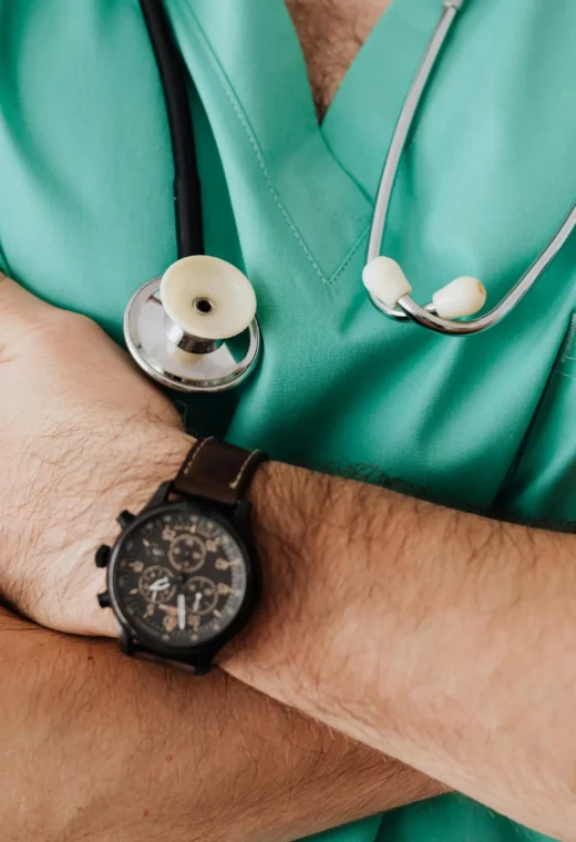 a zoomed in image of an agency nurse crossing their arms