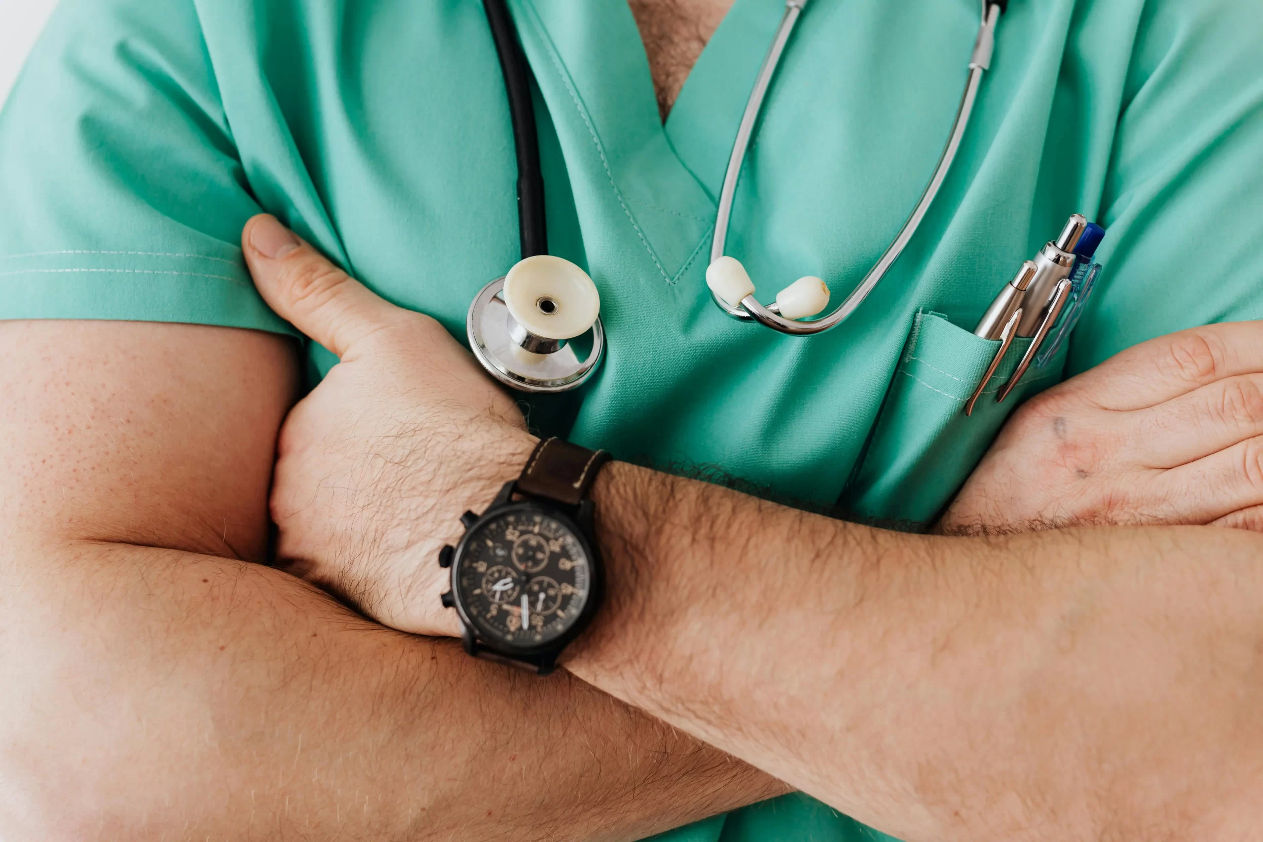 a zoomed in image of an agency nurse crossing their arms