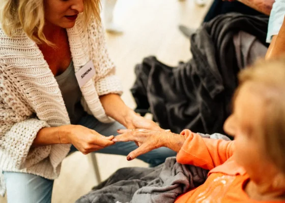 an image of a woman caring for an elderly lady