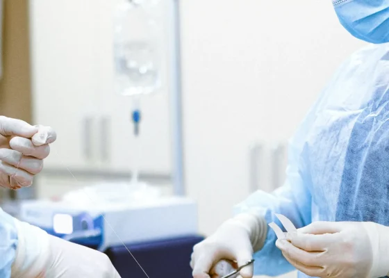 an image of operators cutting stitching string during an operation