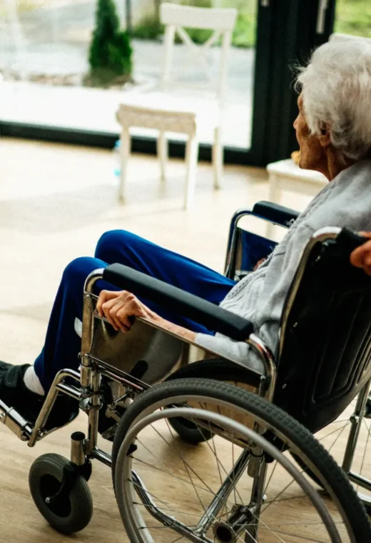 older lady being pushed in a wheelchair