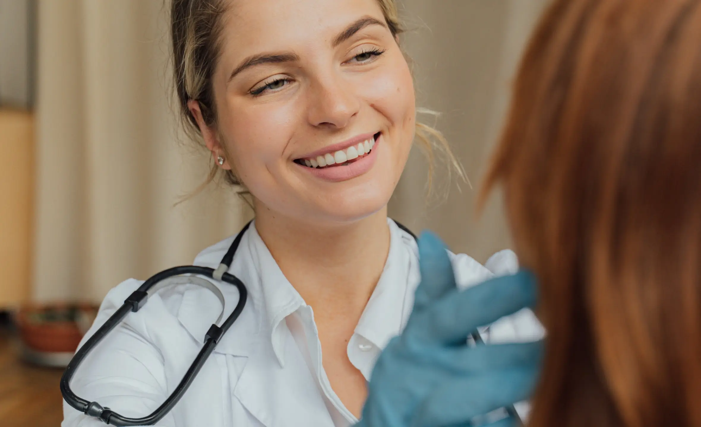 an image of a healthcare assistant with a patient