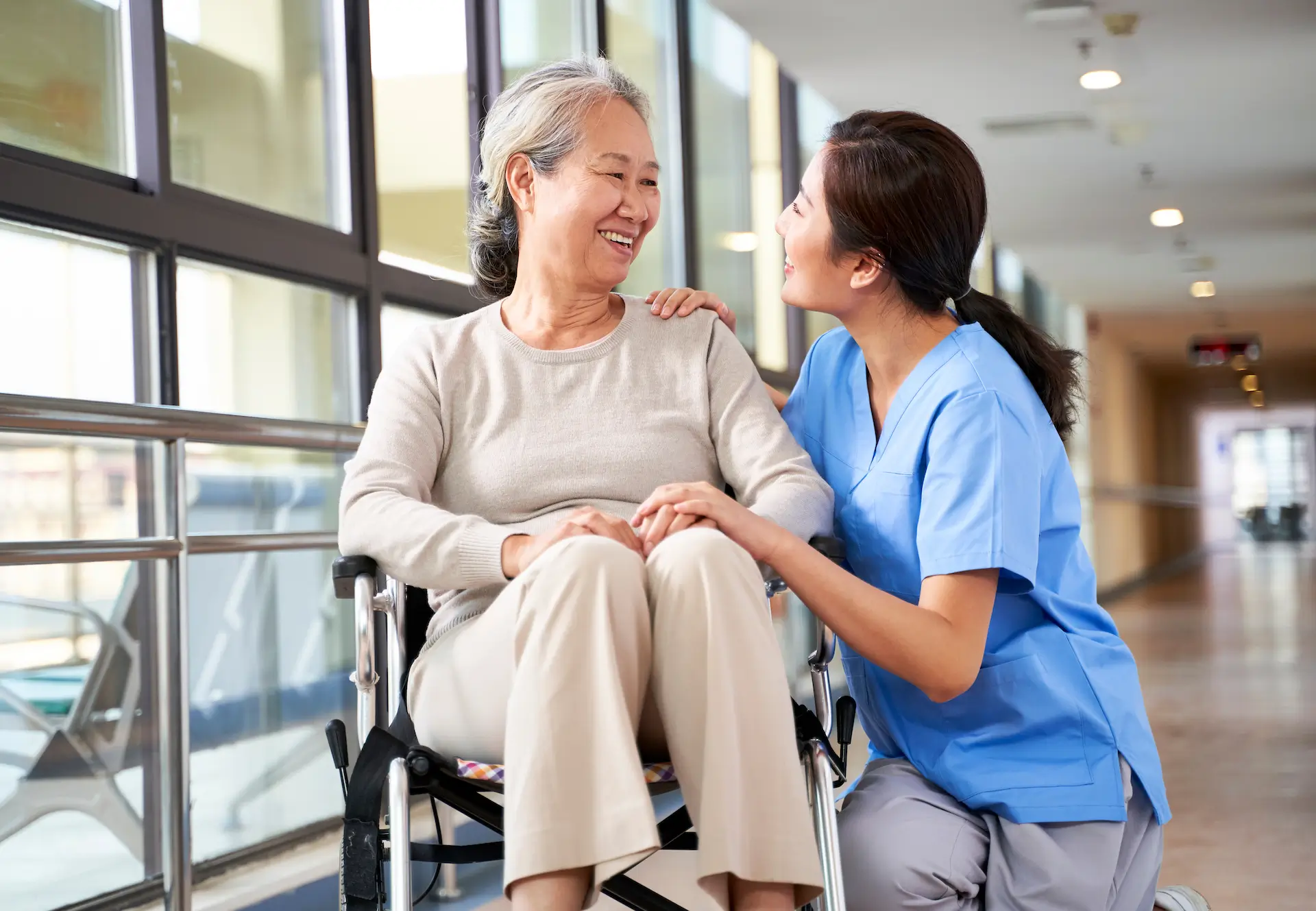 a healthcare assistant talking with a patient