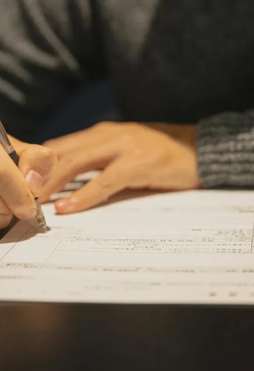 image of a person filling out a health and care worker visa form