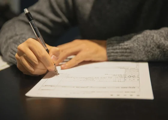 image of a person filling out a health and care worker visa form