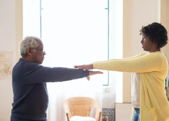 a healthcare assistant and a patient showcasing positive healthcare environments