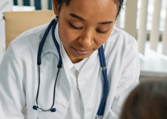 image of a healthcare assistant working on a patient off the frame