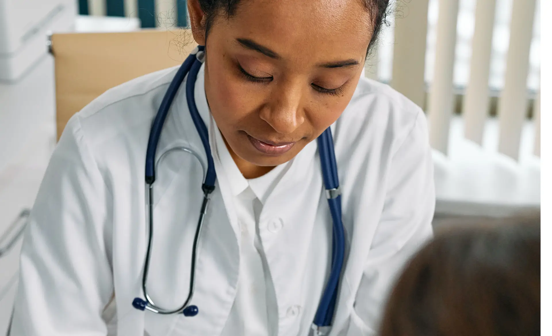 image of a healthcare assistant working on a patient off the frame