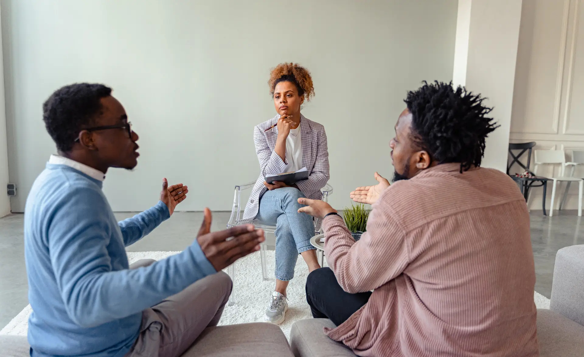 an image of 3 healthcare staff having a discussion