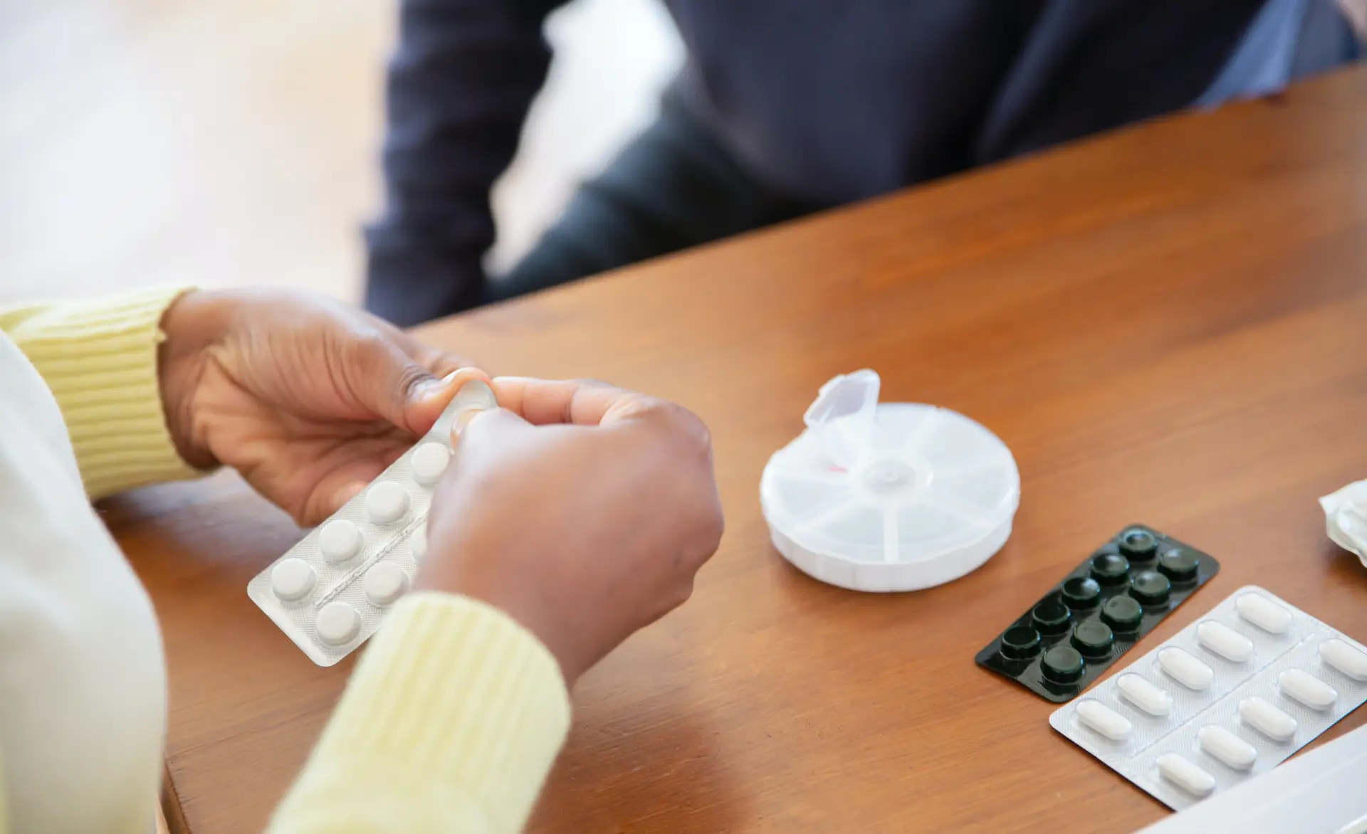 image of a person holding tablets