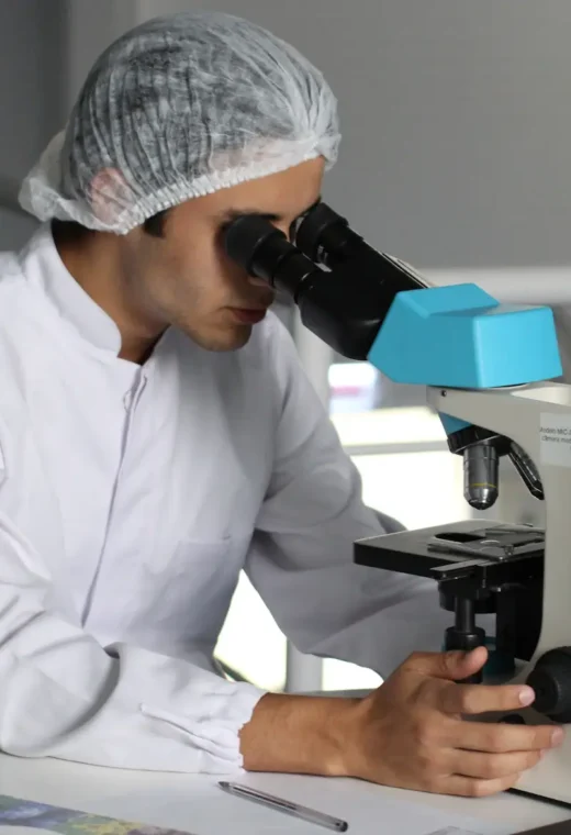 a healthcare professional at work using a microscope