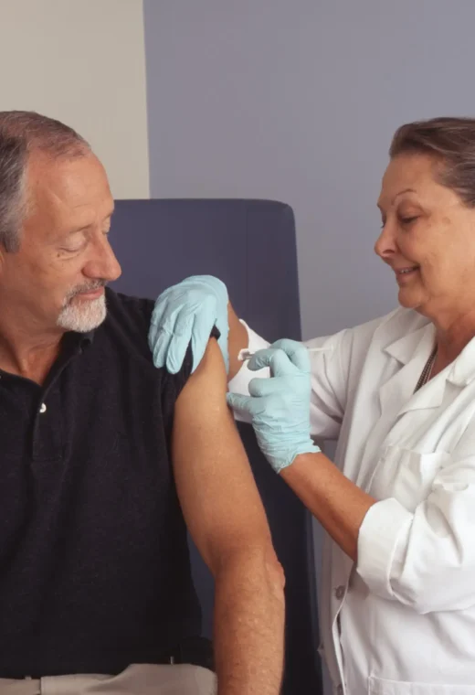 image of a nurse giving an injection to a patient