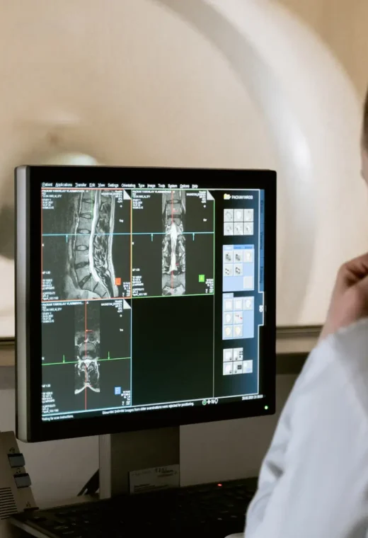 a man sat at a desk showing how technology in healthcare is used