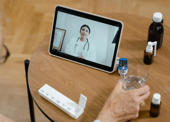 a patient communicating with their doctor via skype, illustrating the rise of virtual healthcare