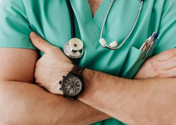 zoomed in image of an urgent care staff member crossing their arms