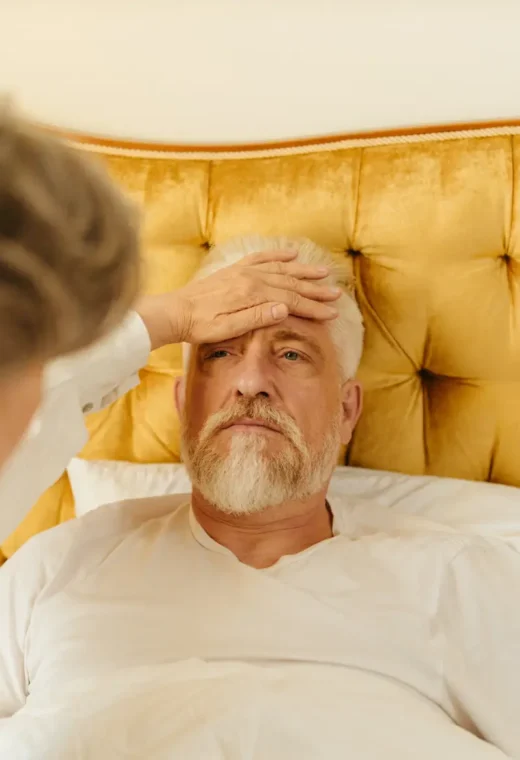 a woman caring for an elderly gentleman