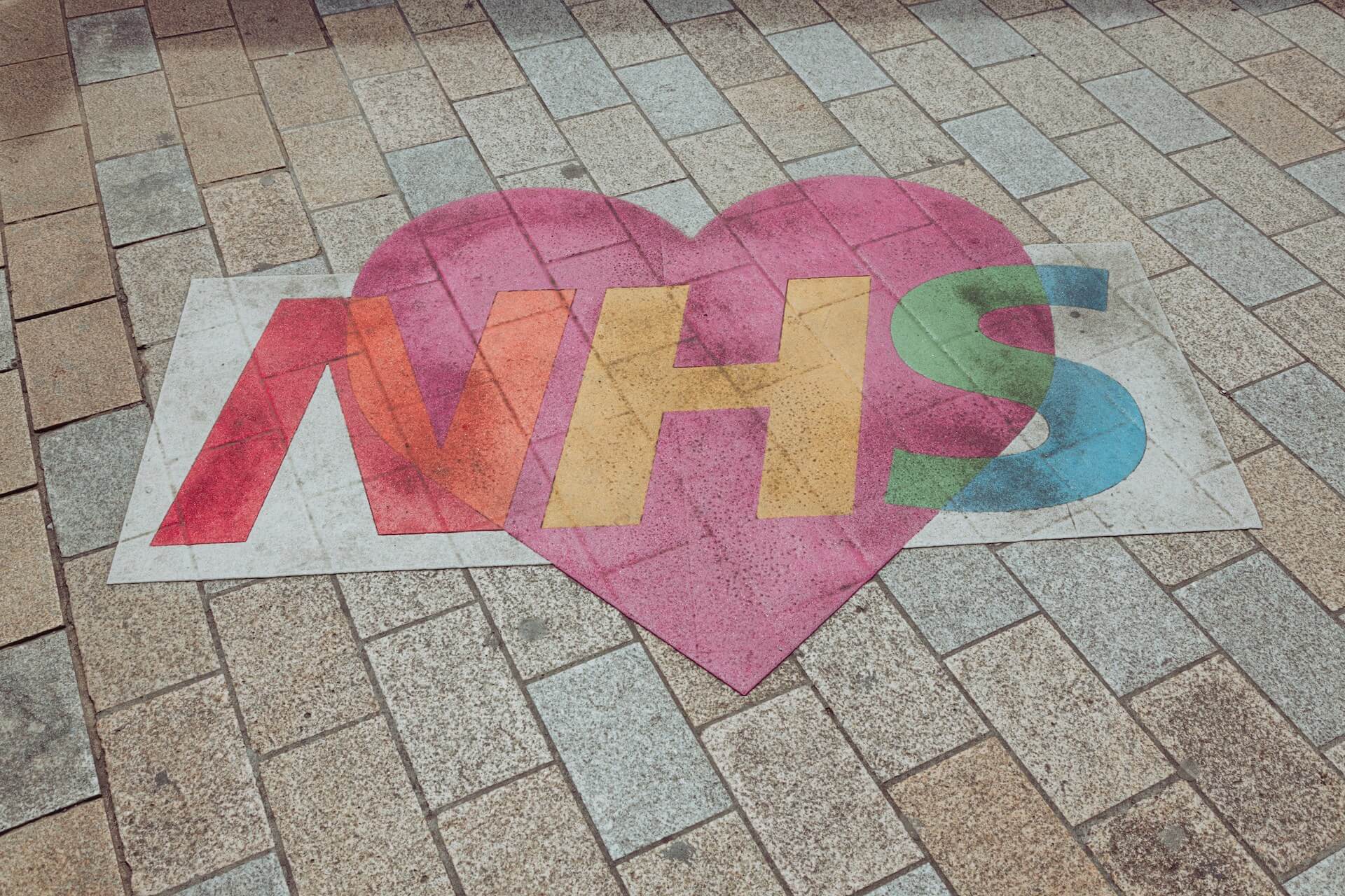 NHS logo on the ground for nurse employment statistics