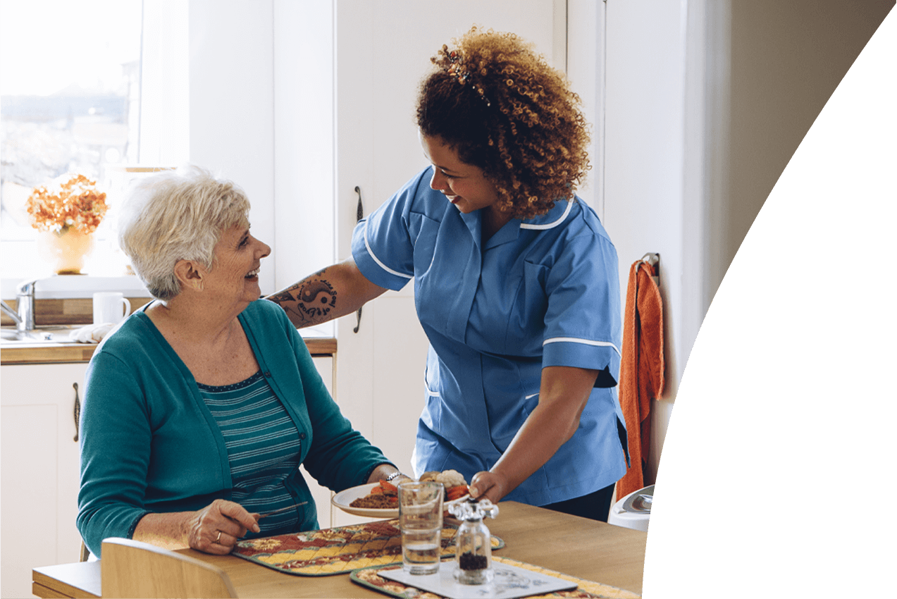 Carer showing how to solve a skills gap in care homes