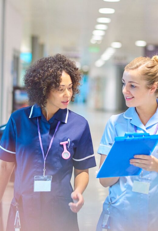 Two agency nurses in a hospital showing the agency nurse grades