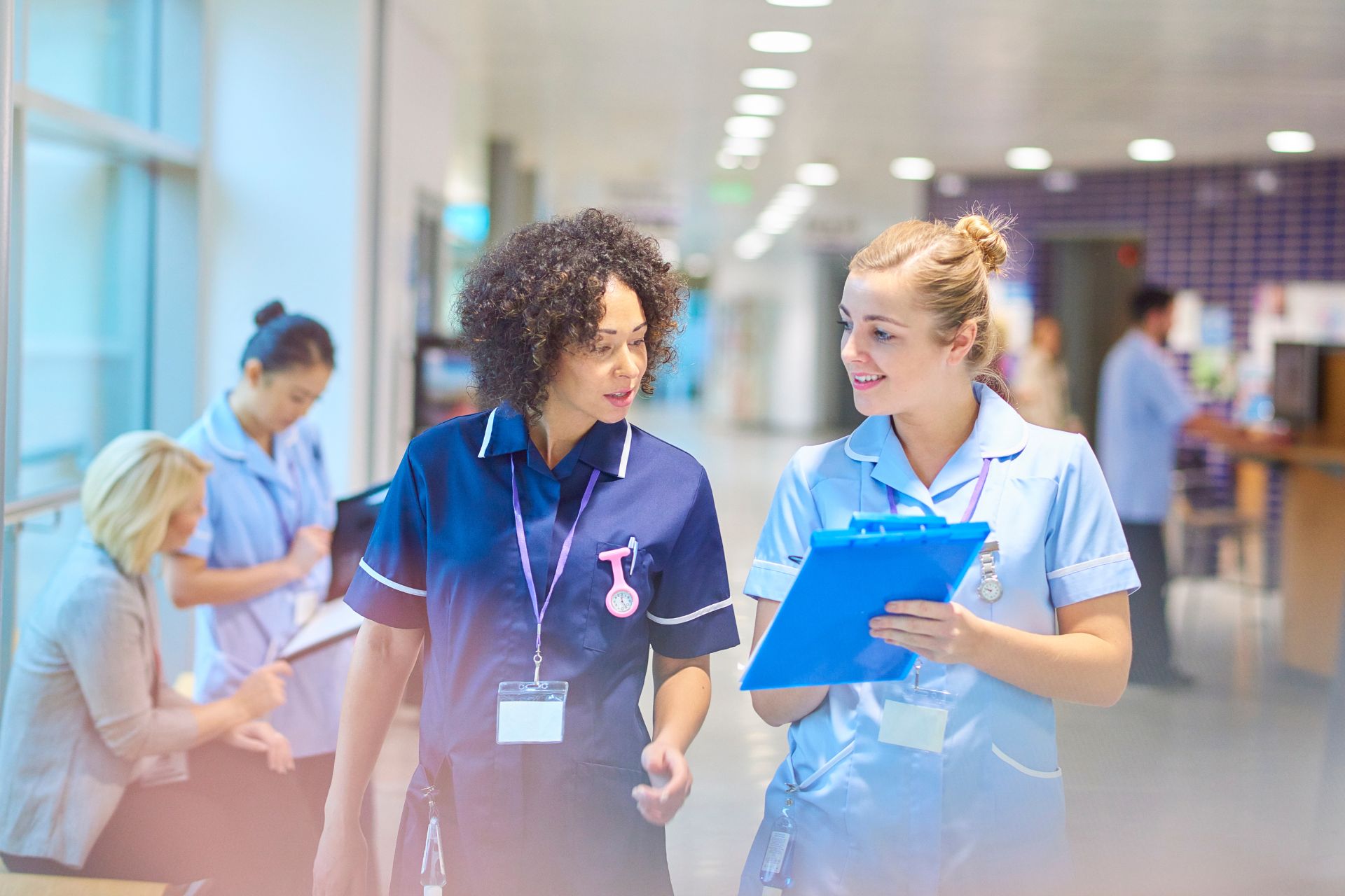 Two agency nurses in a hospital showing the agency nurse grades